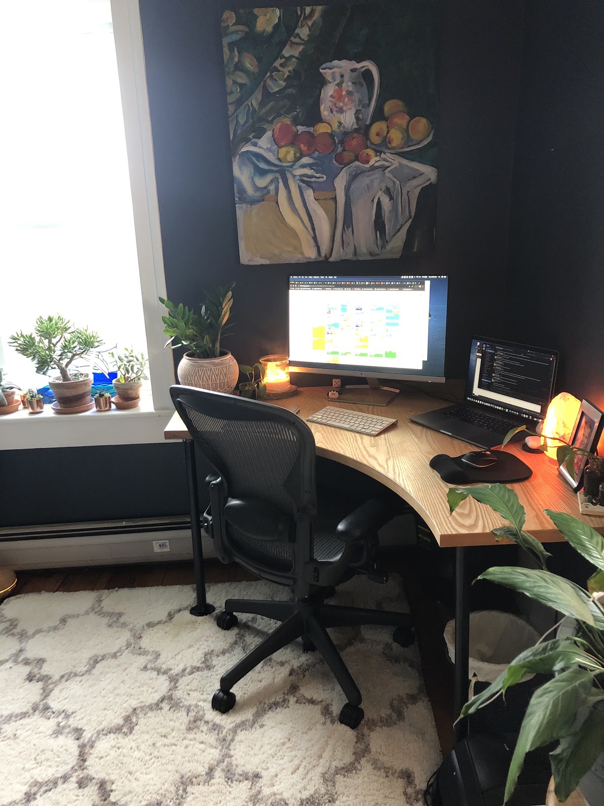 home office with a computer and two screens