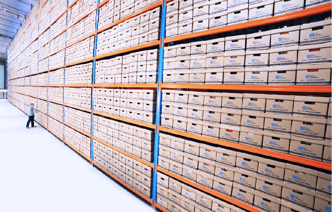warehouse shelves boxes worker scanner