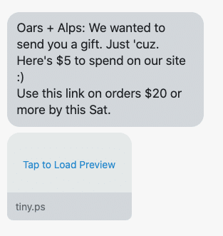 A promotional SMS message from Oars + Alps