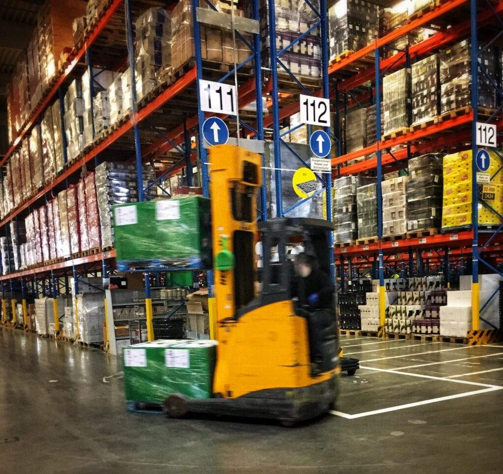 forklift moving pallets of products reverse logistics