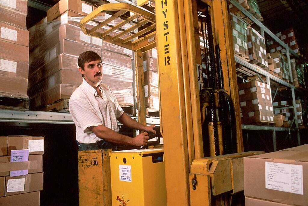 warehouse worker operating forklift reverse logistics