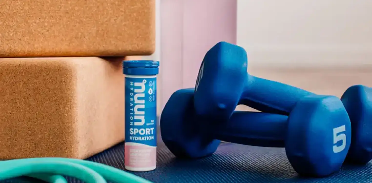 Nuun Product and a pair of dumbbells
